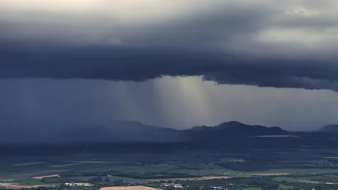 Massive rainfall blankets mountain range and lowlands during tropical monsoon Stock Footage 314358245
