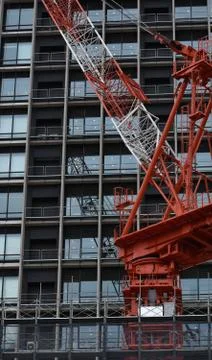 The massive red crane at work in Tokyo Japan Foto stock