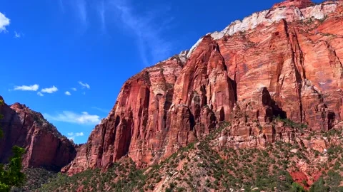 Massive red rock cliff under clear blue sky. Impressive sandstone formations Video stock 304733769