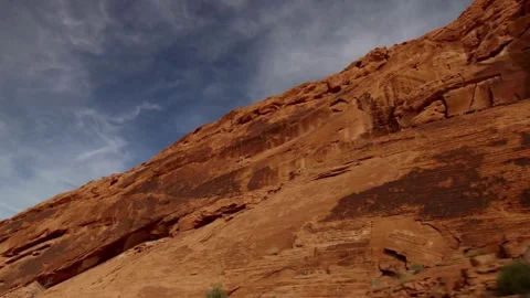 Massive red sandstone cliffs tower over desert landscape outdoors Stock Footage 329559956