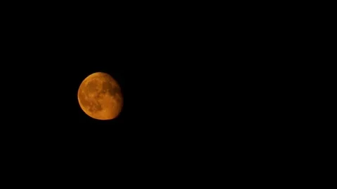 Massive red waning gibbous moon in night... | Stock Video | Pond5