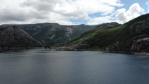 Massive river valley surrounded by mountains, clouds in the sky, Norway Stock Footage 154580657