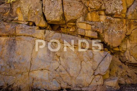 Massive rock wall formation Stock Photos