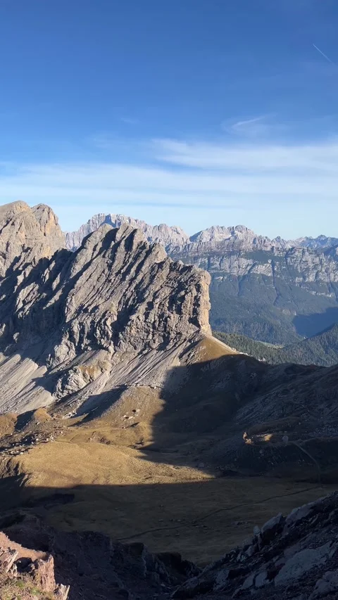 Massive Rocky Peaks of the Dolomites Viewed from Mountain Pass – 4K Vertical Stock Footage 331081083