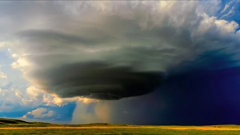 Massive rotating supercell thunderstorm with intense rain and lightning over Stock Footage 344240859