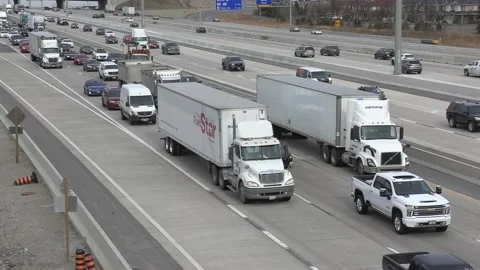 Massive rush hour highway traffic jam with cars and trucks on the road Stockbeeldmateriaal 151058745