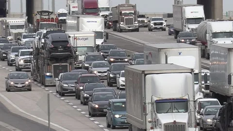 Massive rush hour highway traffic jam with cars and trucks on the road Stockbeeldmateriaal 151059047