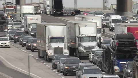 Massive rush hour highway traffic jam with cars and trucks on the road Stockbeeldmateriaal 151059086