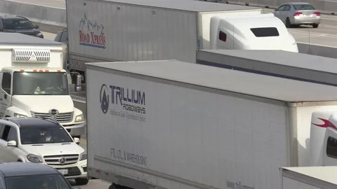 Massive rush hour highway traffic gridlock with cars and trucks driving Stock Footage 151063724