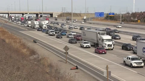 Massive rush hour highway traffic gridlock with cars and trucks driving 動画素材 151063820