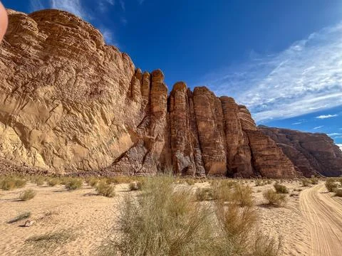 Massive sandstone cliffs in Wadi Rum desert, Jordan Stock Photos