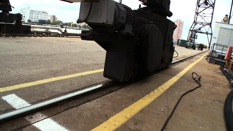 Massive ship building equipment moved on track near construction dock Stock Footage 123724500