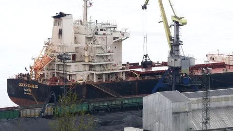 A massive ship is loaded with coal at the Murmansk seaport. Stock Footage 328461963