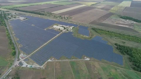 Massive solar power station in the fields, drone view, renewable energy Stock Footage 160114246