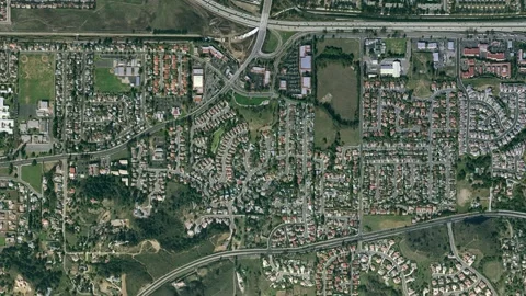 A massive spaceship passes over a freeway interchange Видео 133680477