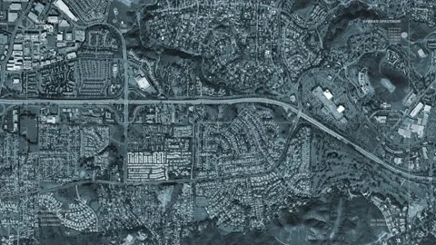 A massive spaceship passes over a small US city. With HUD Video stock 133680711