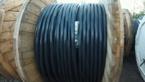Massive spools of cable at a construction site, laying of the cable Stock Footage 160113441