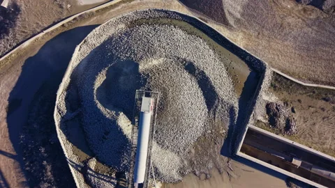 Massive stone mound rises above landscape, showcasing a unique construction in Vídeos de archivo 335362564