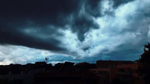 Massive Storm Cloud Timelapse Moving Over Urban Skyline in 4K Stock Footage 341668278