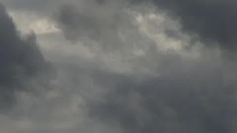 Massive storm clouds rushing across the sky, dark gray moody atmosphere in .. 스톡 동영상 331995159
