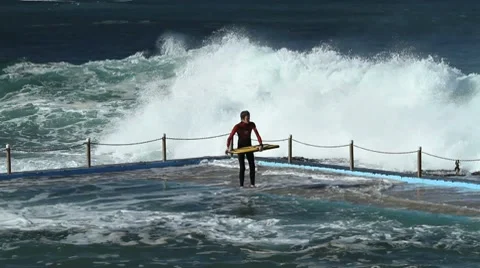 Massive Surf Engulfs Youth Stock Footage 7750783