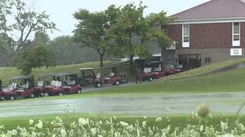 Massive thunderstorm cloud rolls in over golf course with heavy rain and wind Stock Footage 135613830