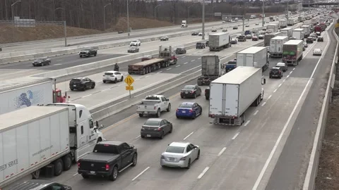 Massive Toronto highway traffic jam with cars and trucks on the busy 401 Video stock 151059727