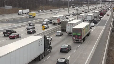 Massive Toronto highway traffic jam with cars and trucks on the busy 401 Video stock 151059951