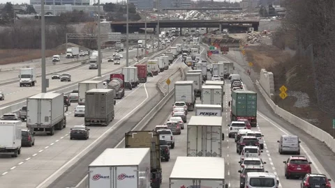 Massive Toronto highway traffic jam with cars and trucks on the busy 401 Видео 151060275