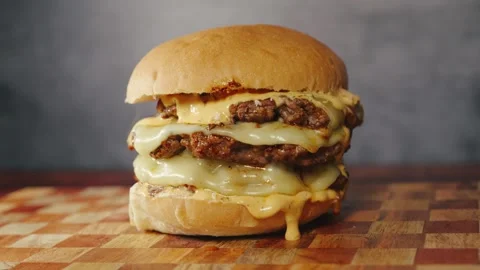 Massive Triple Deck Smash Cheese Burger Stock Footage 325223993