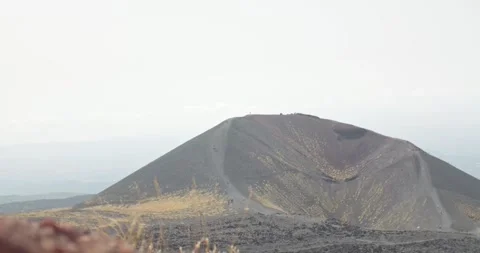 Massive volcanic mount of black rocks near Etna Volcano, Sicily, Italy, 4k Video stock 332714918