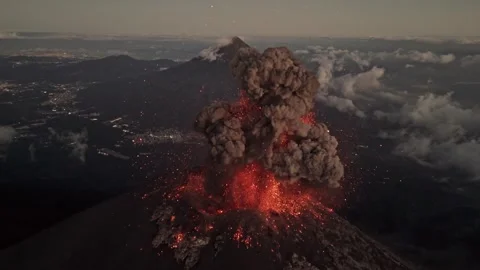 Massive volcano explosion with lava and smoke, aerial drone close up view Stock Footage 311015634