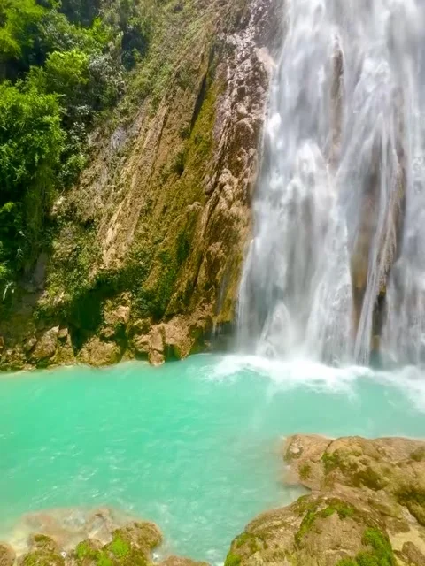 Massive Waterfall Flowing into Turquoise Pool Video stock 340264041