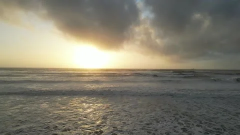 Massive waves with a beautiful Sunset Stock Footage 229414672