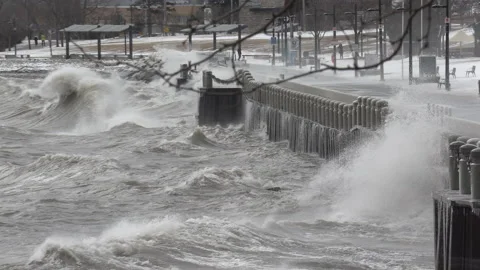 Massive waves breaking and crashing into shore in hurricane force wind storm. Stockbeeldmateriaal 147992915