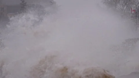 Massive waves crash into shore in typhoon and hurricane force wind storm Stock Footage 88518767
