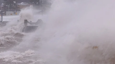 Massive waves crash into shore in typhoon and hurricane force wind storm Stock Footage 88531252
