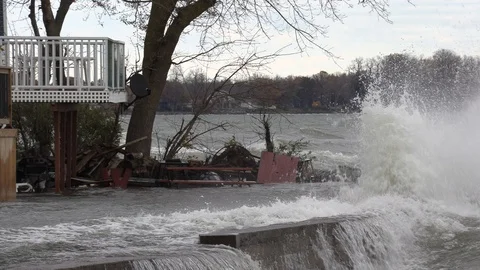 Massive waves flooding homes and shoreline during hurricane force storm surge Stock Footage 97910937