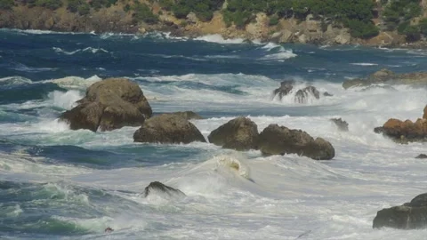 Massive waves hitting coastal rocks during rough sea Stock Footage 168775280