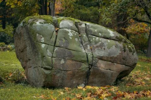 A massive, weathered granite boulder Stock Photos