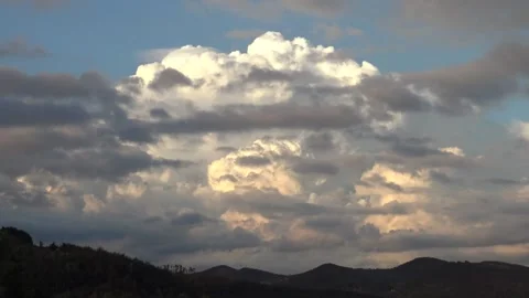 Massive white cloud hidden behind grey clouds Stock Footage 159079117