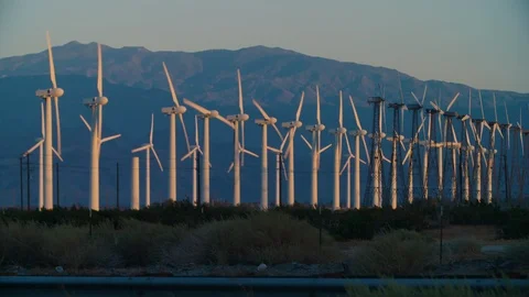 Massive wind turbines spin on windy day at the San Gorgonio Pass WindFarm Stock Footage 113293310