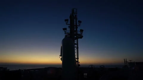 Mast on bow of ship. Sky at sunset in the background. Vessel in sea. Stock Footage 172045090