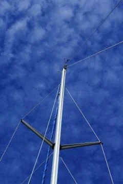 Mast with cotton wool clouds in the background Stock Photos