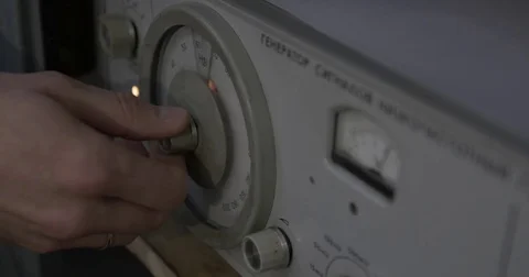 The master adjusts the old device to change the sound. the USSR Stock Footage 85393753