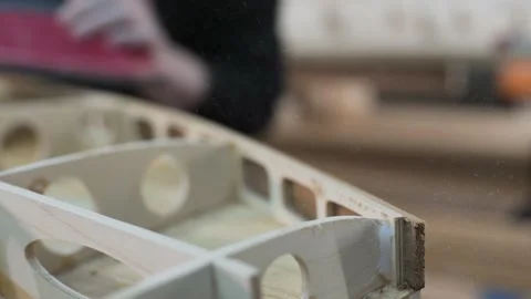 Master aligns the edge of the surf Board Stock Footage 132348352