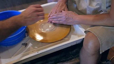 Master and apprentice learning clay crafting potter Stock Footage 87224405