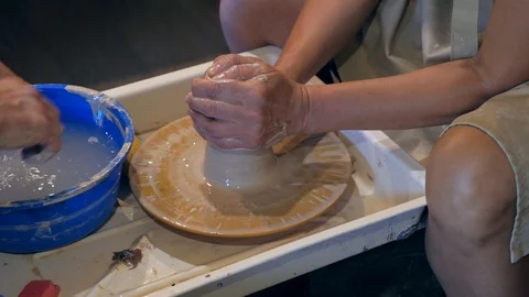 Master and apprentice learning clay crafting at workshop Stock Footage 87227352
