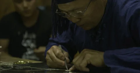 Master and apprentice working Stock Footage 141356562