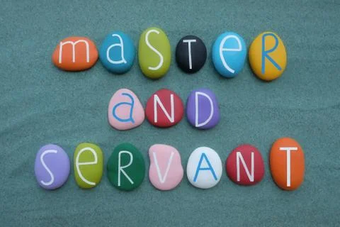 Master and Servant, conceptual text composed with multicolored stone letters Stock Photos